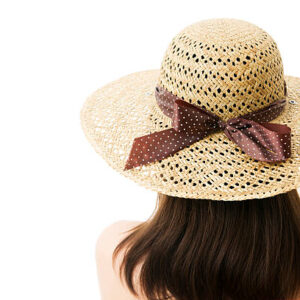 Woman in straw hat isolated on white background. unrecognizable.