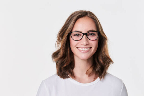 Glasses girl in white t shirt, smiling
